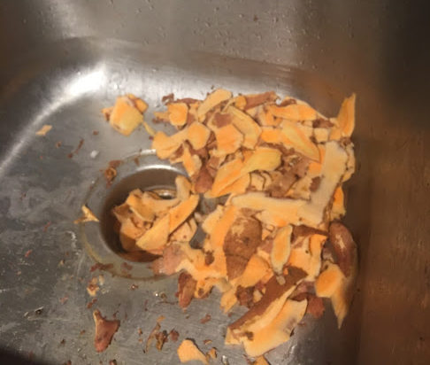 Sink with Sweet Potatoes A sink full of potato peelings is a happy sink.